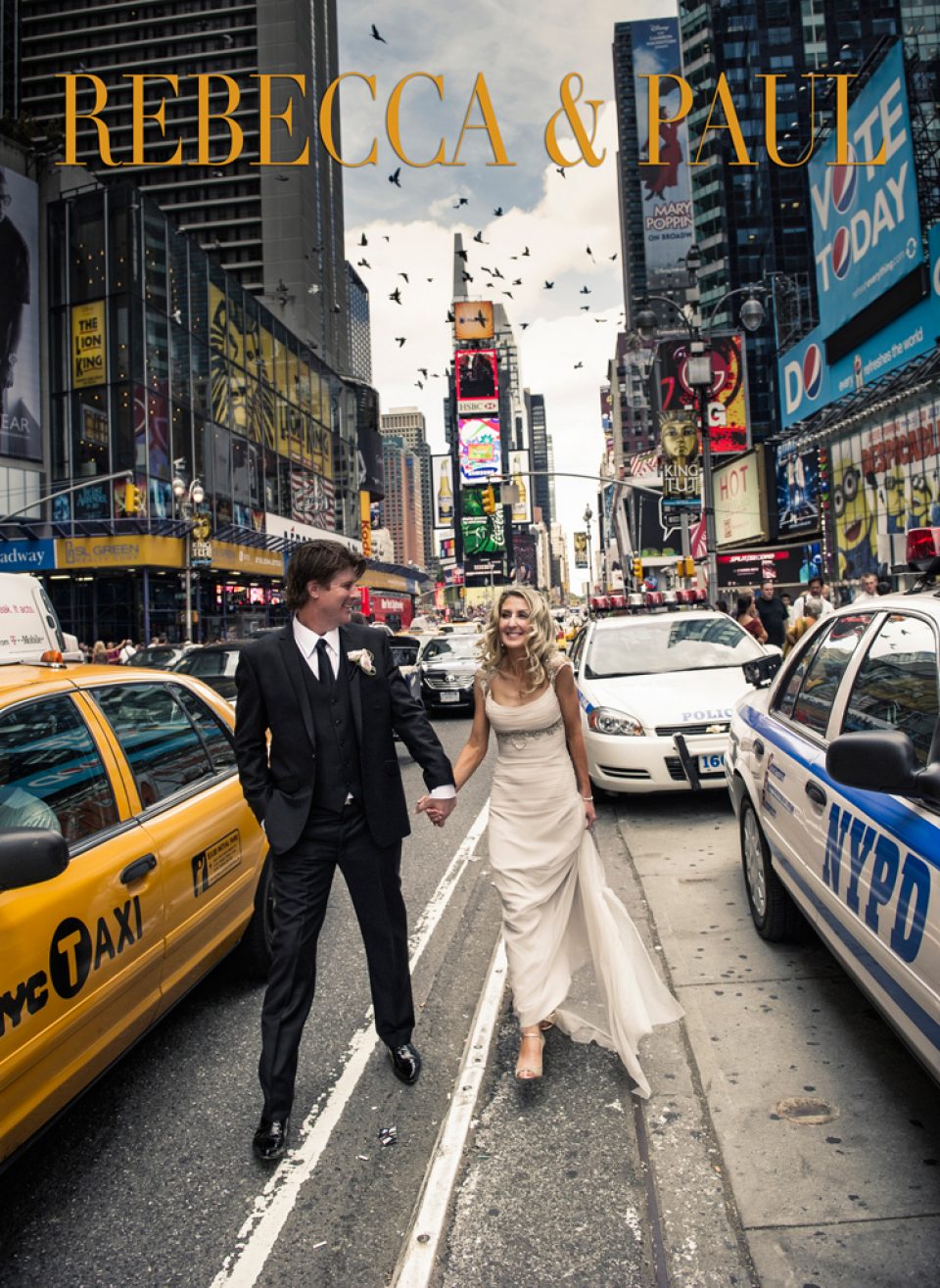 smiling couple on wedding day. walking on the road in new york city, between a yellow cab and a police car.