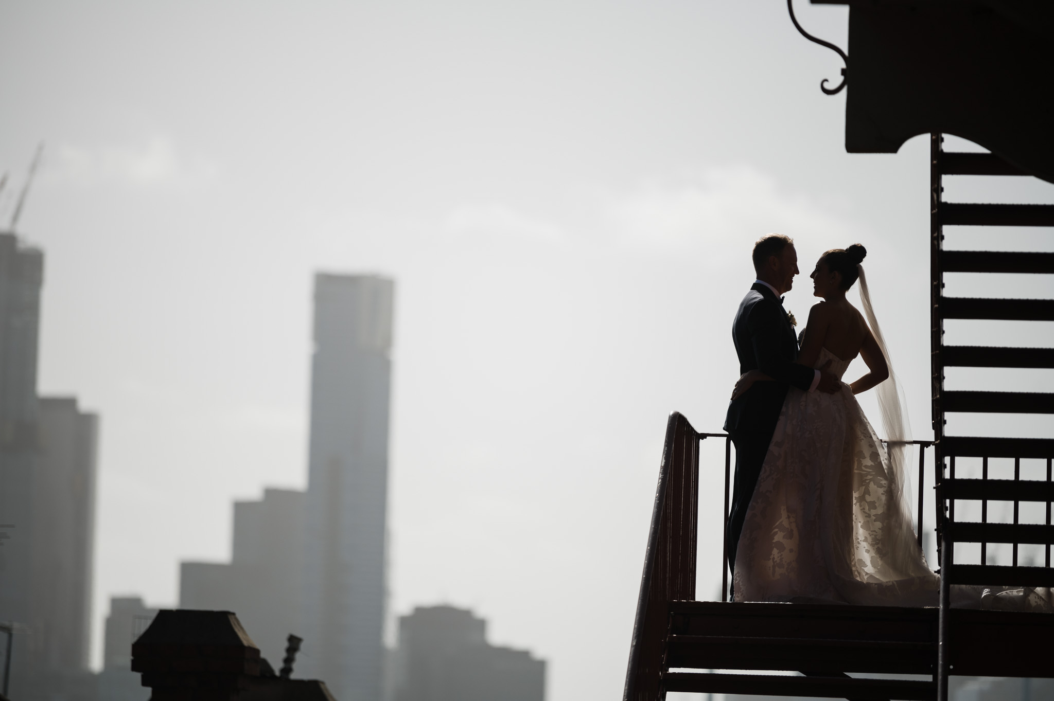 Bride and Groom silhouetted against the melbourne city skyline