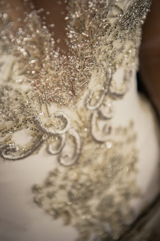 Close detail photograph of Annette of Melbourne wedding dress, showing silver embroidery and beading