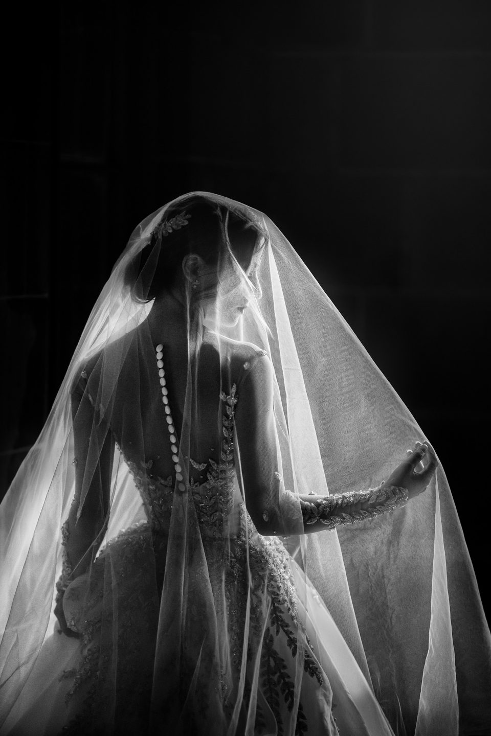 bride wearing veil over bun on wedding day