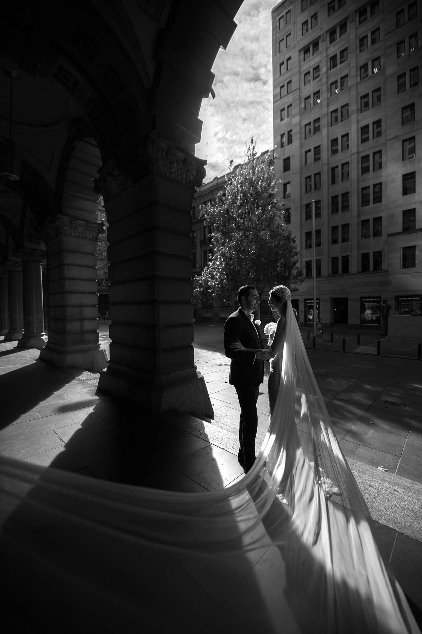 black and white wedding photo with long veil