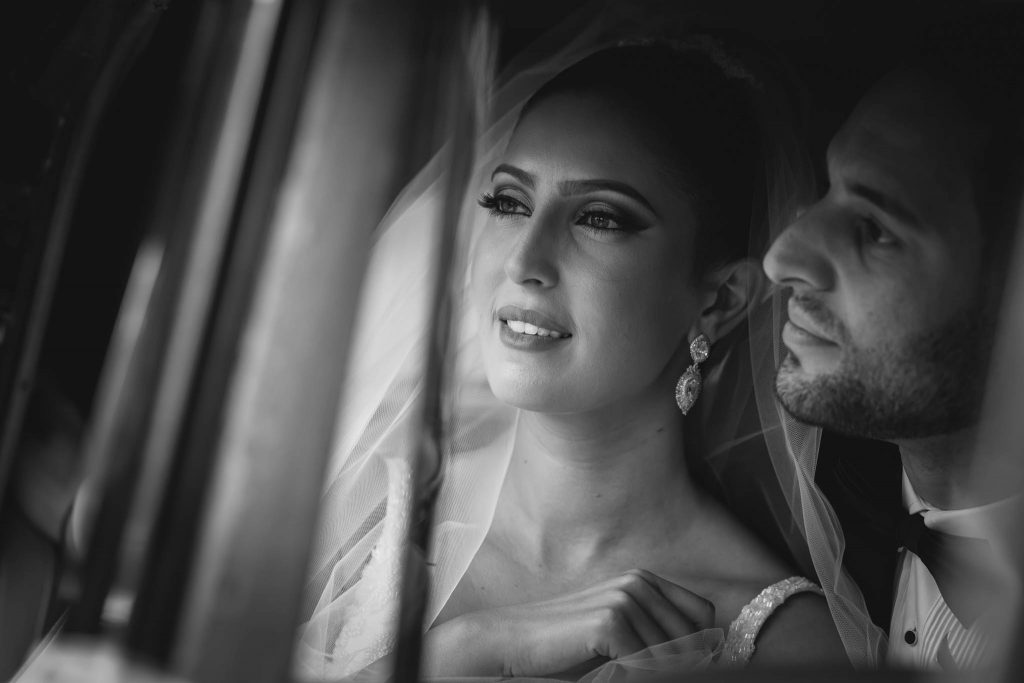 wedding photo of couple in car