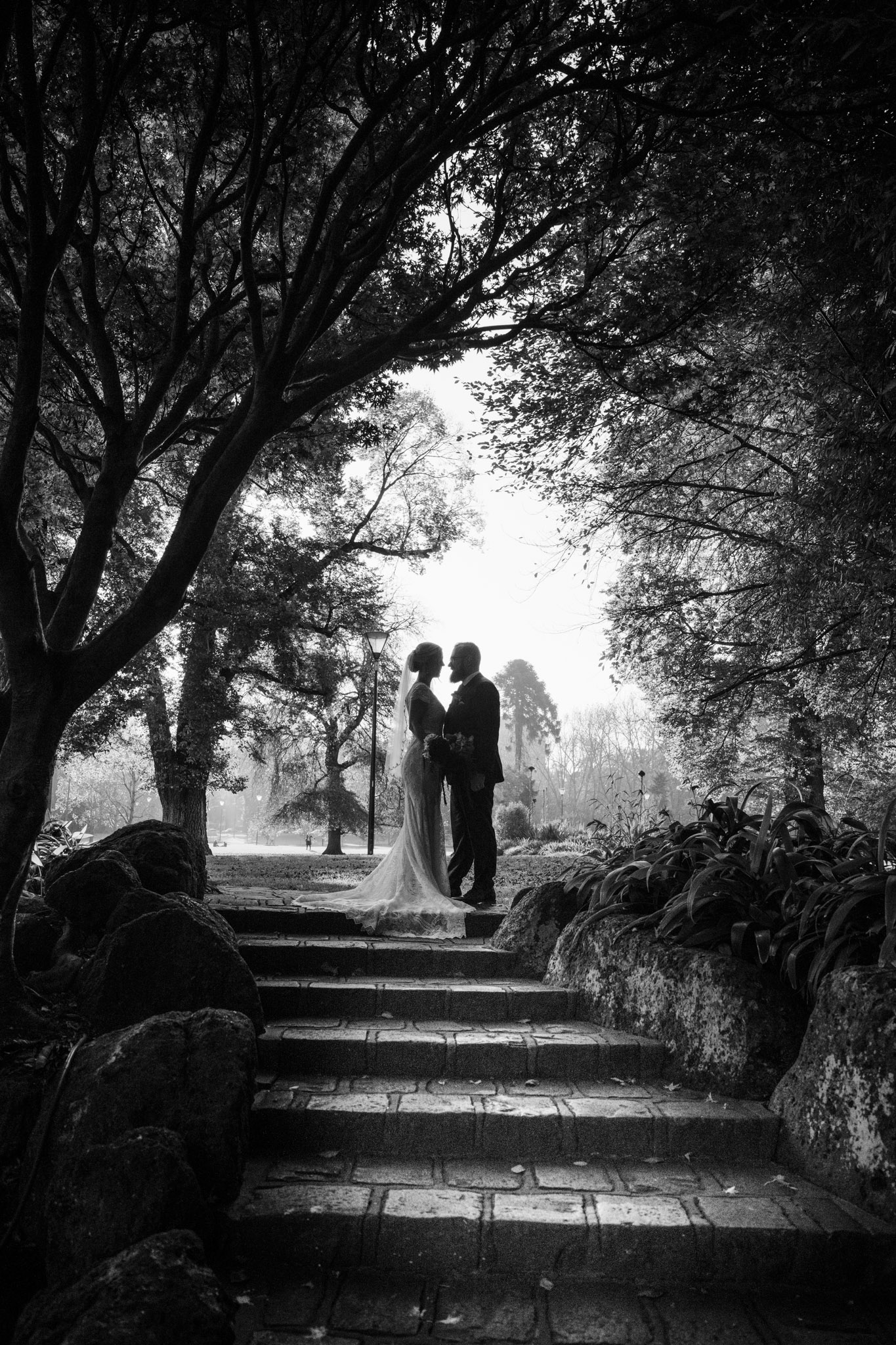 Black and white wedding photo of couple in Fitzroy Gardens