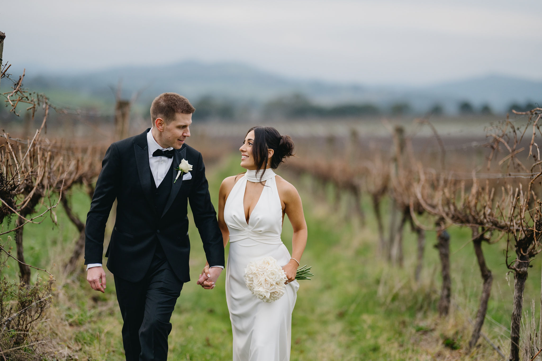 Tokar Estate Wedding: Gary and Lemma walk through vineyard