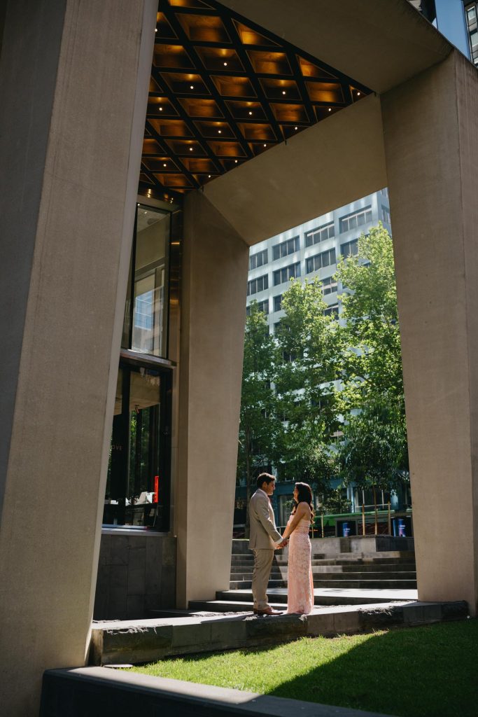 Architectural wedding portraits near Collins Street before Taxi Kitchen reception