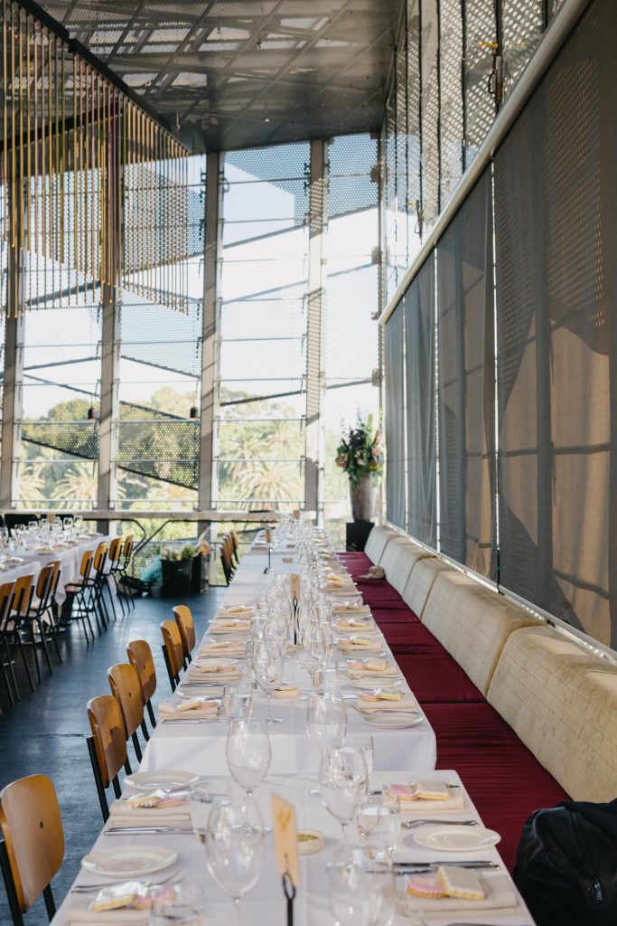 Long reception table inside Taxi Kitchen wedding venue Melbourne