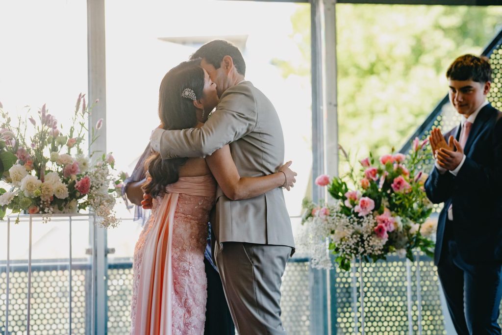 Bride and groom embracing during Melbourne CBD wedding ceremony