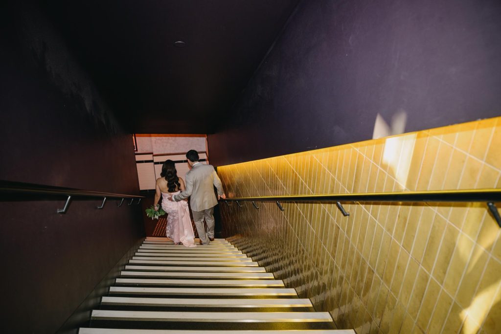 Architectural staircase portraits during Taxi Kitchen wedding
