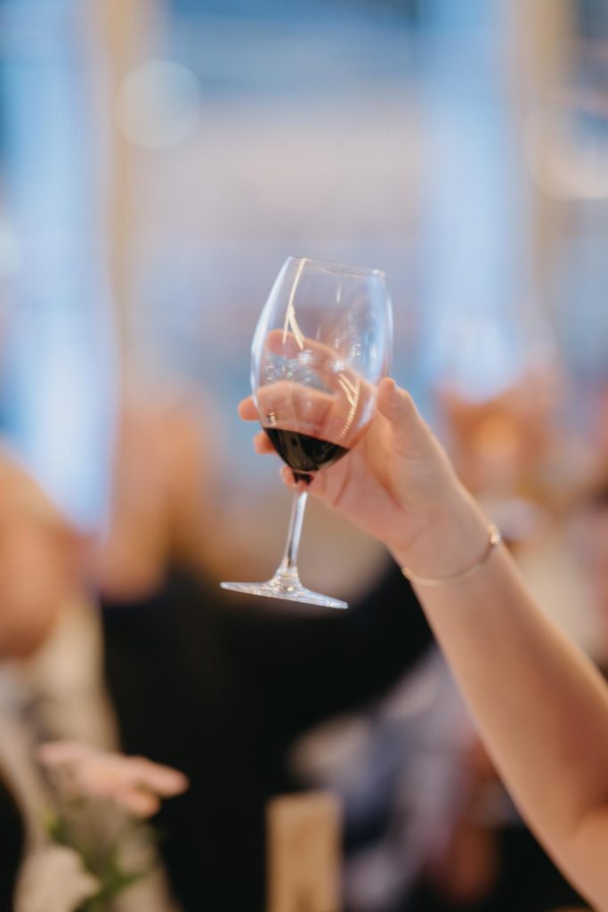 Red wine toast during Melbourne CBD wedding reception
