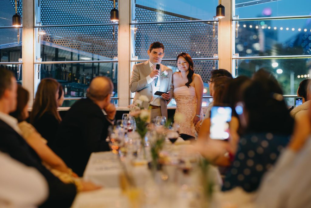 Guests listening to speeches at Transport Hotel wedding reception