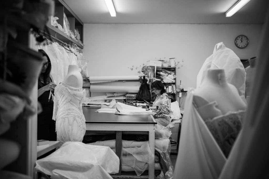 Seamstresses handcrafting couture wedding gowns inside the Annette of Melbourne atelier