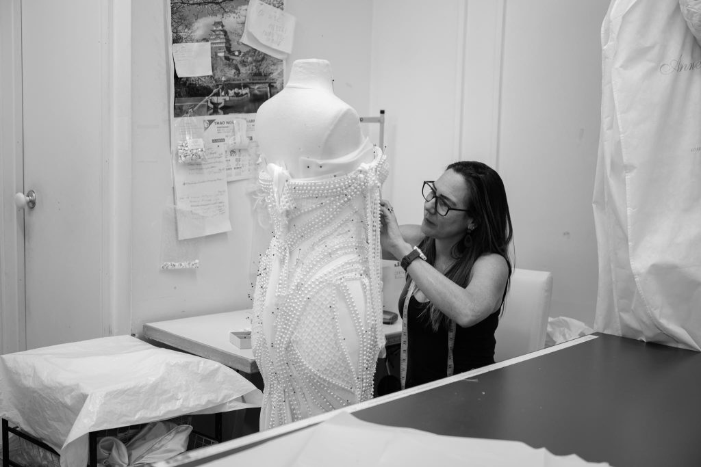 Seamstresses handcrafting couture wedding gowns inside the Annette of Melbourne atelier